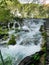 Low shutter speed of beautiful waterfalls, Plitvice lakes national park UNESCO, dramatic unusual scenic, green foliage alpine