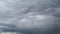 Low stormy clouds in the blue sky. Timelaps