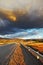 Low swirling cloud and gravel road