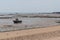 Low tide boat on sand in beach Oyster Parks Countryside of Ile d`Aix in France