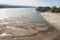 Low tide of the Danube river with people silhouettes walking on the sand islands left after water withdrawal in the Novi Sad, Serb