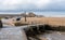 Low tide exposes the small boats moored in the harbor at Bude