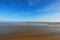 Low tide in front of Mont Saint-Michel abbey. Amazing landmark. Sunny spring morning view. Normandy, France, Europe