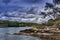 Low tide in Poludlu, Brittany, France, with a small castle ruin