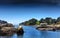 Low tide in Poludlu, Brittany, France, with a small castle ruin