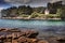 Low tide in Poludlu, Brittany, France, with a small castle ruin