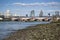 Low tide River Thames and London city skyline including St Paul\'