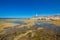 Low tide rocky seaside in Trafalgar Cape with lighthouse reflect