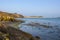 Low tide in a shingle cove at Inchydoney Island