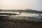 Low tide shoreline and Haji Ali Dargah mosque in the background in Mumbai, India