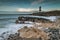 Low tide at the Trwyn Du lighhouse at Penmon Point in Anglesey.