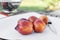 Low View of Amigo Pluot Fruits with a Knife