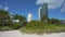 Low view of Miami Beach city with expensive beachfront hotels and condo buildings on Atlantic ocean shore. American