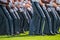 Lower body view of the gray uniform pants of Army cadets as they march.