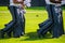 Lower body view of the gray uniform pants of Army cadets as they march.