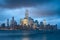 Lower Manhattan illuminated skyscrapers and storm clouds, New York City