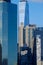 The Lower Manhattan New York City Wall Street buildings and skyscrapers creating canyons in dark shadows at late afternoon