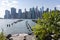 Lower Manhattan Skyline seen from the Brooklyn Heights Promenade with Green Plants during Summer