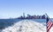 Lower Manhattan view from cruise ship or yacht with the flag of the United States of America in New York. Scenic view to NYC.