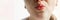 Lower part part of woman face with Red bubbles of virus herpes on her lips, she kisses the air, white background, Zoster, Cold,