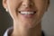 Lower part of young woman face with charming healthy smile