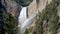 Lower yellowstone falls and a rainbow from red rock point in yellowstone