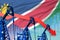 Lowering, falling graph on Namibia flag background - industrial illustration of Namibia oil industry or market concept. 3D