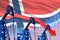 Lowering, falling graph on Norway flag background - industrial illustration of Norway oil industry or market concept. 3D