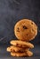 Lowkey picture of chocolate cookies on dark background, close-up, shallow depth of field