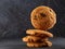 Lowkey picture of chocolate cookies on dark background, close-up, shallow depth of field