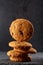 Lowkey picture of chocolate cookies on dark background, close-up, shallow depth of field