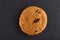 Lowkey picture of two chocolate cookies on dark background, close-up, shallow depth of field