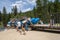 Lowman, Idaho - July 1, 2019: Whitewater Rafting groups prepare to launch a raft for a river rafting trip down the ramp for a trip