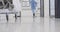 Lowsection of african american male doctor running in hospital corridor, slow motion