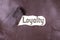 Loyalty word written on torn leather