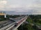 LRT , Monorail movement on track moving fast taken at station Cibubur. with background of traffic ,mountain and sky. Jakarta,