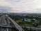 LRT , Monorail movement on track moving fast taken at station Cibubur. with background of traffic ,mountain and sky. Jakarta,