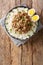 Lu Rou Fan Taiwanese Braised Pork Rice Bowl Ground pork served on top of steamed rice close-up in a plate. Vertical top view