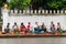 Luang Prabang, Laos - circa August 2015: Traditional Alms giving ceremony of distributing food to buddhist monks on the streets of