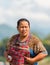 LUANG PRABANG, LAOS - JANUARY 11, 2017: Portrait of a laotian woman in the garden. Vertical. Copy space for text.