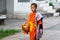 Luang Prabang, Laos - May 2019: Laotian Buddhist monk walking along the street during alms giving ceremony