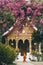 Luang Prabang, Laos - May 2019: Laotian Buddhist monk walking in front of Wat Pa Phai