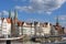 Lubeck, Germany, April 11, 2022: Old town of Lubeck on the river Trave near Baltic Sea, historical sailboats, city houses and