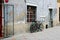 Lublin city street landscape, two bicycles are located near the wall, no people in the street