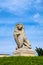 Lublin, Poland - Monumental statue of a lion, symbol of Lviv city in front of medieval Lublin Castle royal fortress in historic