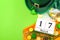 The luck of the Irish meme and Happy St Patricks day concept theme with a calendar, leprechaun hat, beads necklace and gold coins