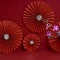 Lucky Chinese new year red background decoration with cherry blossom flower and paper fan