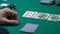 Lucky gambler checking cards, winning combination in poker, ace-high straight