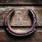 Lucky horseshoe, old and rusty hanging on barn