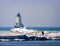 Ludington`s North Breakwater Light in Mason County, Michigan Lighthouse in the Winter with sightseers.
